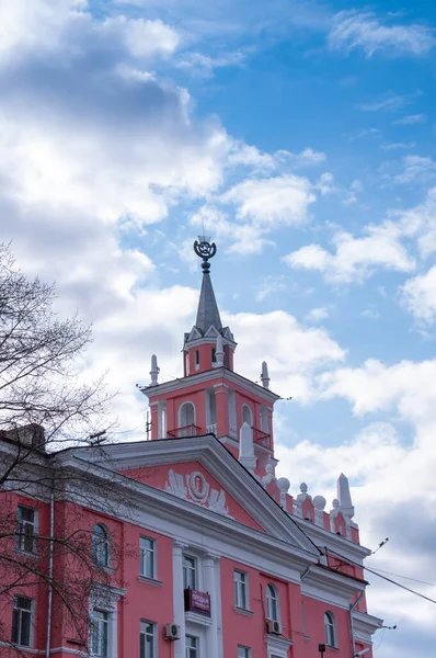 Komsomolsk-on-Amur, a pink building with a spire