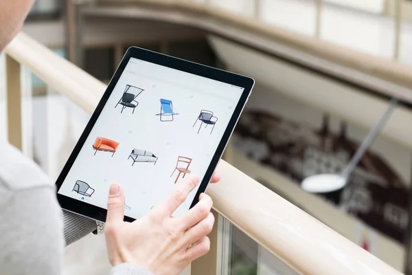 Man Holding Tablet Buying Furniture Online — Stock Photo, Image