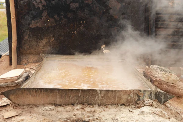 stock image salt water boiling for natural salt production in northeast of Thailand