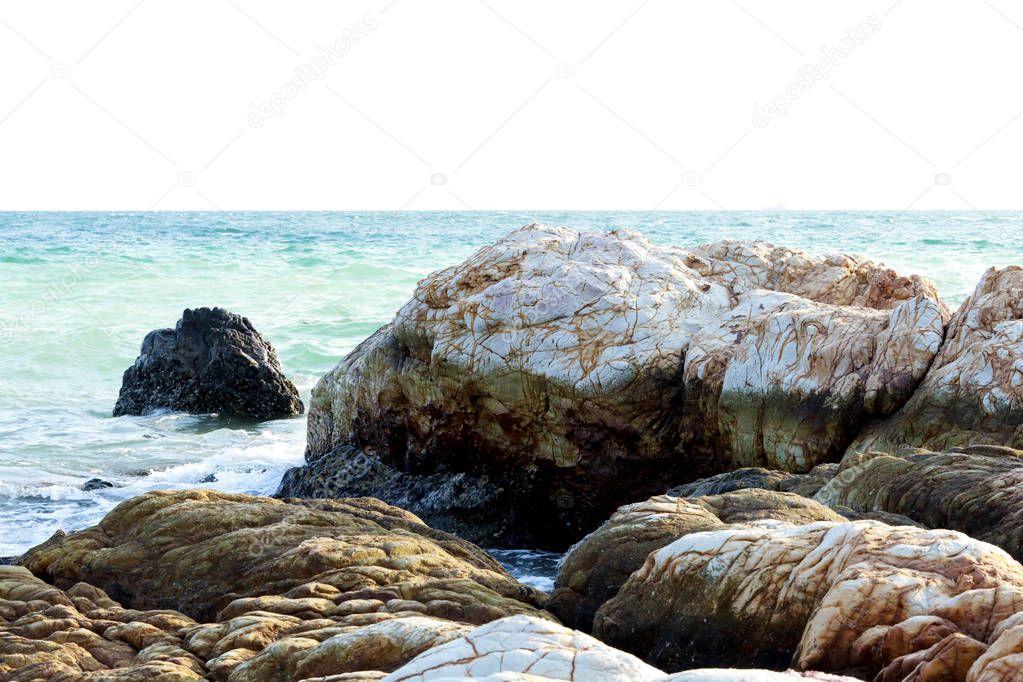 Stones or rocks above or below surface of sea.