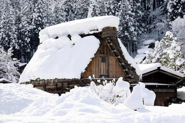 Old Japanese house with snow on roof, Japan