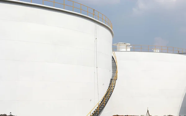 Huge oil storage tanks, At construction site of oil and gas industrial with the cloudy sky background