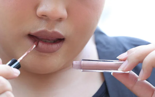 Man\'s Mouth with light brown Lipstick on his Chubby Lips