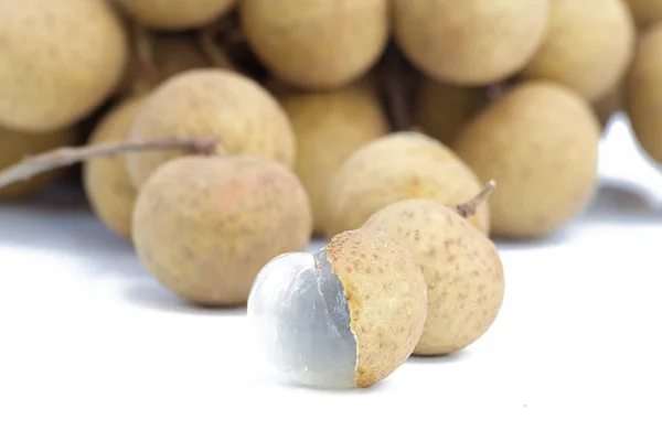 Longan fruit on a white table background.