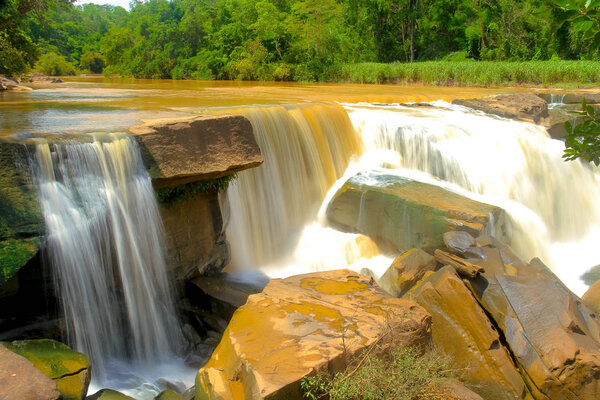 waterfalls background: Namtok Kaeng Sopha is a waterfall and tourist attraction in Wang Thong district of Phitsanulok Province in Thailand.