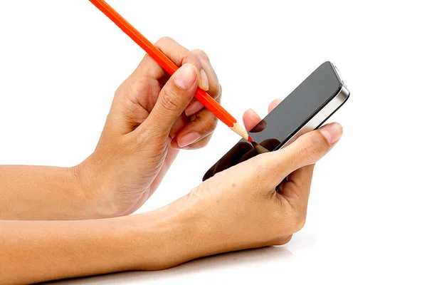 Hand holding smartphone with pencil in the other hand on white t — Stock Photo, Image