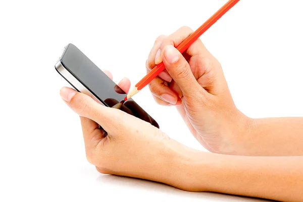 Hand holding smartphone with pencil in the other hand on white t — Stock Photo, Image