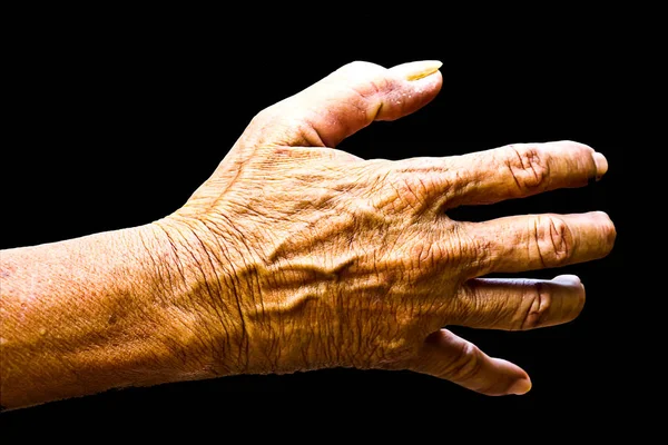 Old man hand isolated on black background — Stock Photo, Image