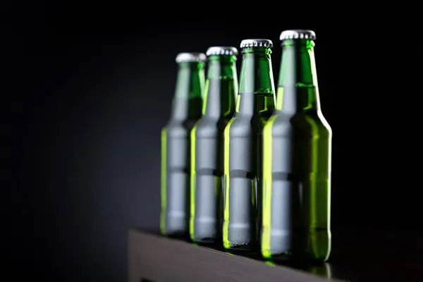 Four Bottles Cold Beer Row Bar Counter — Stock Photo, Image