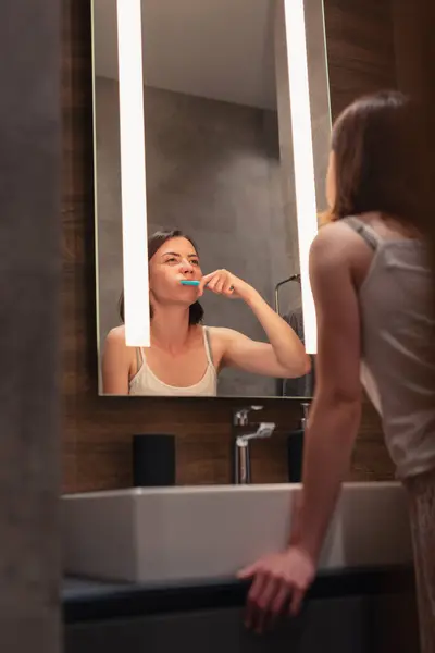 Beautiful Young Woman Standing Front Mirror Next Sink Bathroom Brushing — Stock Photo, Image