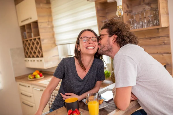 Couple Having Fun While Eating Breakfast Home Sitting Kitchen Counter — Stock Photo, Image