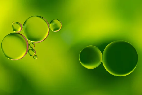 Gouttes vertes de bulles d'huile et d'air sur l'eau — Photo
