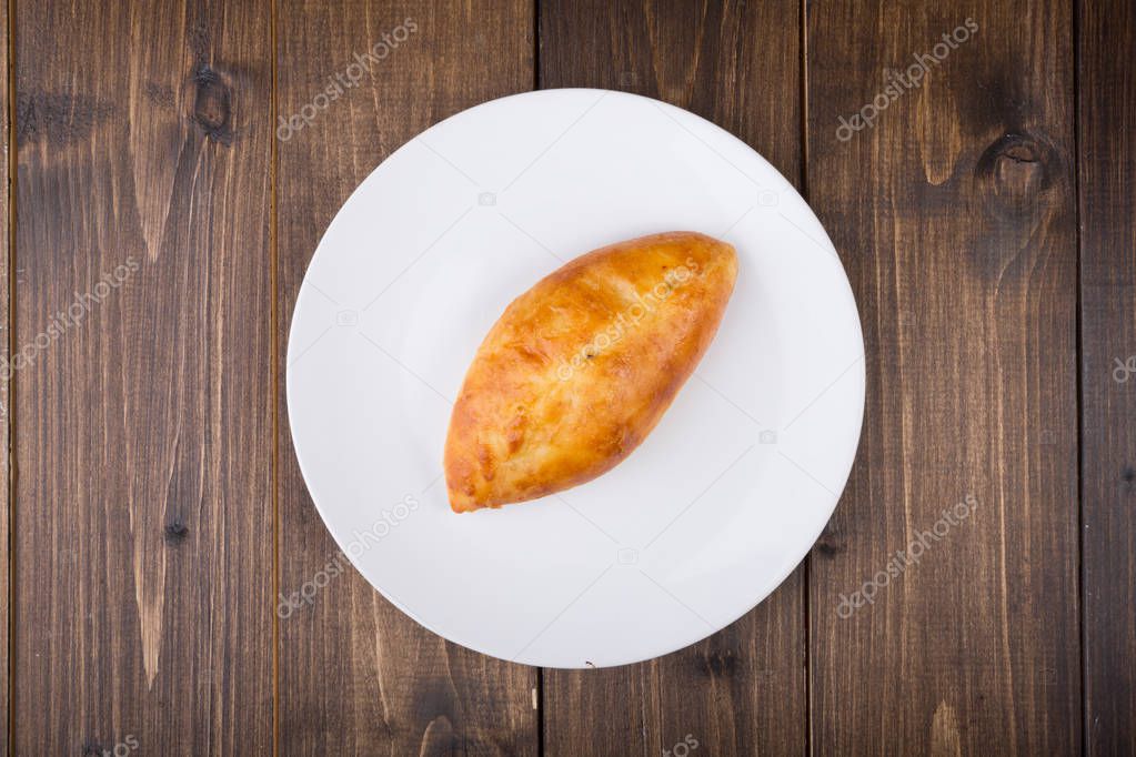 Russian traditional pirogi dough stuffed with meat