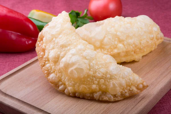 Fried stuffed asian dough bread stuffed with cheese or meat — Stock Photo, Image