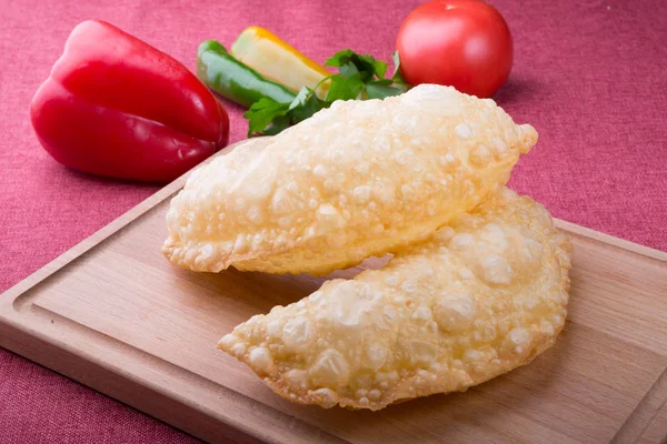 Fried stuffed asian dough bread stuffed with cheese or meat — Stock Photo, Image