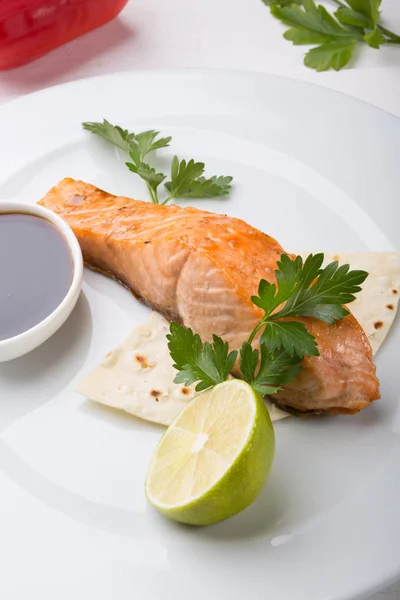 Prepared salmon steak served on a plate — Stock Photo, Image