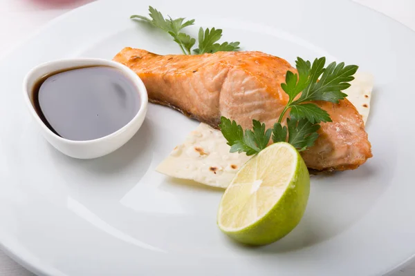 Prepared salmon steak served on a plate — Stock Photo, Image