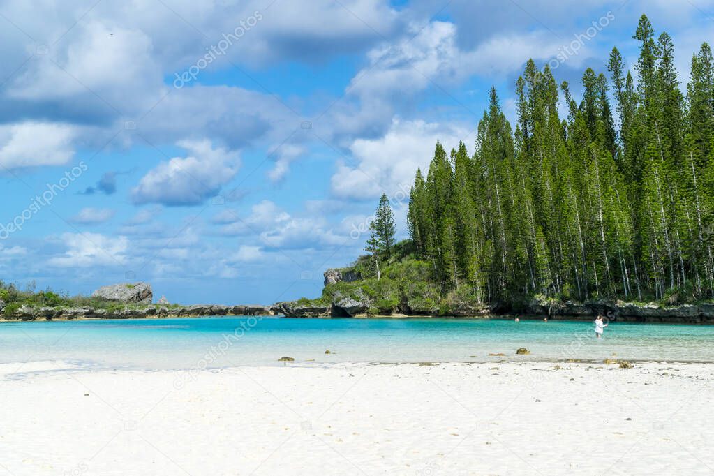 Beautiful seascape of natural swimming pool of Oro Bay, Isle of Pines, New Caledonia. aquamarine translucent water.