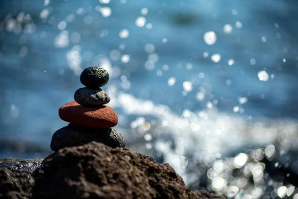 Closeup Shot Pebbles Stacked Each Other Balance Blue Sea Background Royalty Free Stock Photos