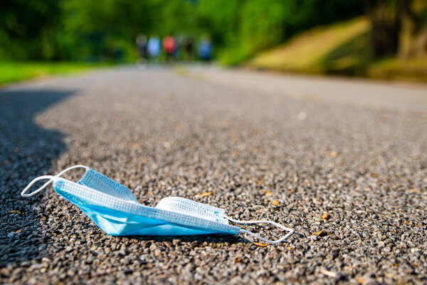 Mask thrown away along a road