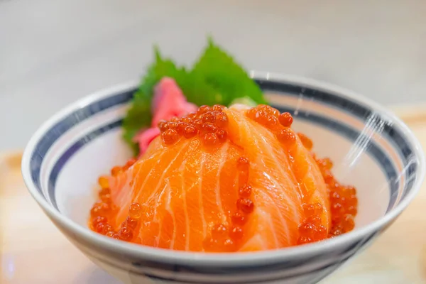 Japanese food Salmon sashimi, salmon\'s egg (ikura), shredded radish and slice ginger with japanese rice donburi,Salmon don.