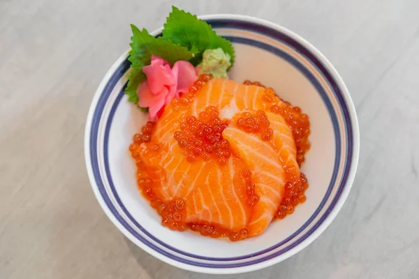 Japanese food Salmon sashimi, salmon\'s egg (ikura), shredded radish and slice ginger with japanese rice donburi,Salmon don.