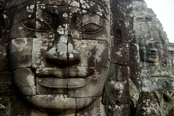 Stone face at the Bayon Temple the Tempel Ruins of Angkor Thom in the Temple City of Angkor near the City of Siem Reap in the west of Cambodia
