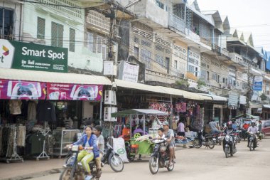 CAMBODIA, KAMPONG THOM - NOVEMBER, 2017: Mainroad in the city centre of Kampong Thom of Cambodia clipart