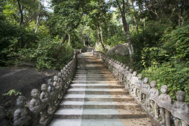 Stairs and Path a the Phnom Santuk Temple near of the city of Kampong Thom of Cambodia clipart