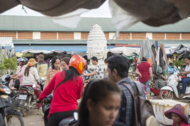 CAMBODIA, KAMPONG THOM - NOVEMBER, 2017: Khmer square at the market Psar Kampong thom in the city of Kampong Thom of Cambodia clipart