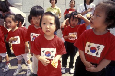 children at a monument of the Korean War Memorial in the city of Seoul in South Korea in EastAasia.  Southkorea, Seoul, May, 2006 clipart