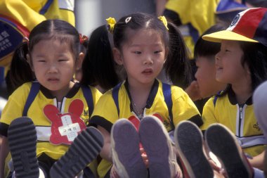 children at a monument of the Korean War Memorial in the city of Seoul in South Korea in EastAasia.  Southkorea, Seoul, May, 2006 clipart