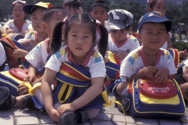 children at a monument of the Korean War Memorial in the city of Seoul in South Korea in EastAasia.  Southkorea, Seoul, May, 2006 clipart