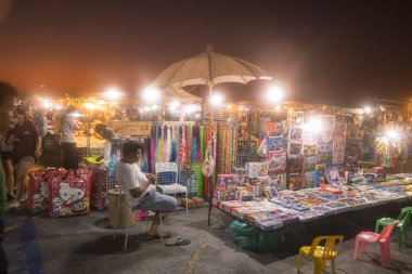 the Night market and walking street at the Coast of Laemtan at the Bang Saen Beach at the Town of Bangsaen in the Provinz Chonburi in Thailand.  Thailand, Bangsaen, November, 2018 clipart