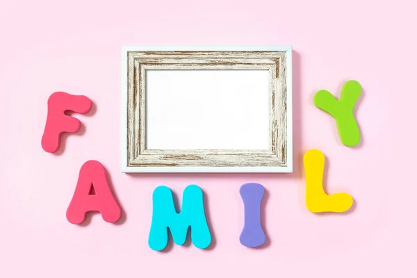 Word Family Wooden Photo Frame Pink Background Flat Lay Top — Stock Photo, Image