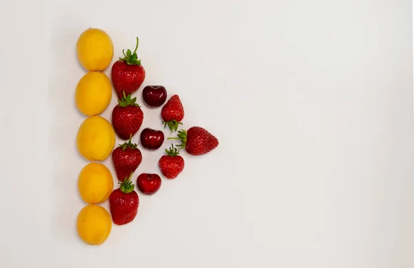 Arrow made of fruits isolated on white — Stock Photo, Image