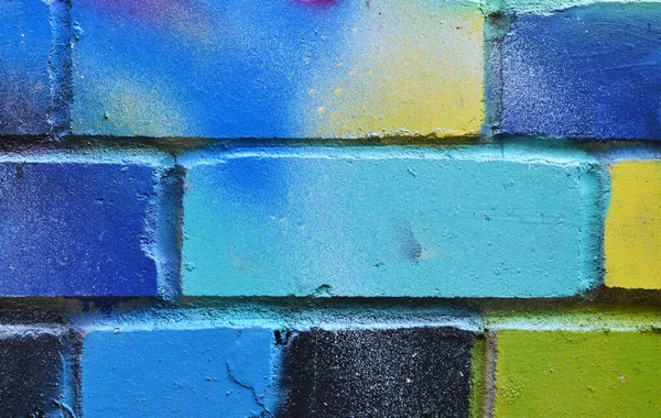 Colorful brick wall from multi colored bricks close up. Street art. Place for text. Bright blue colour — Stock Photo, Image