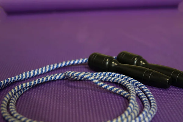 jump rope of on violet mat