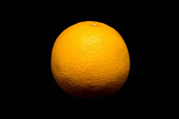 Studio shot of the whole orange isolated on black background — Stock Photo, Image