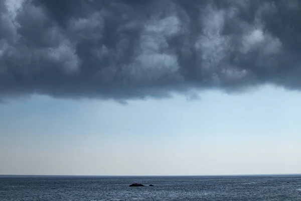 Dark moody sky over the gray sea — Stock Photo, Image