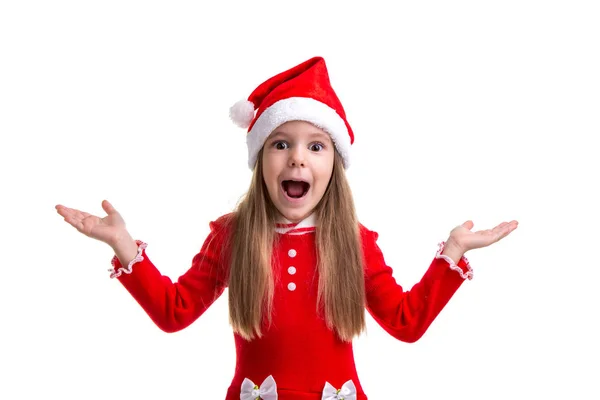 Surpreendido e chocado Natal menina vestindo um chapéu de Papai Noel isolado sobre um fundo branco — Fotografia de Stock