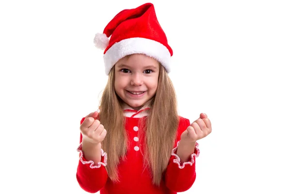 Kerst meisje balde de vuisten, het dragen van een kostuum van santa, geïsoleerd op een witte achtergrond — Stockfoto