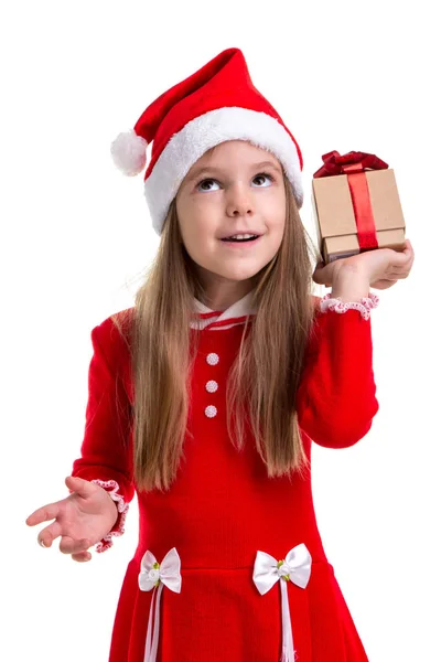 Curiosa Menina Natal Segurando Uma Caixa Presente Mão Vestindo Chapéu — Fotografia de Stock