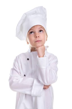 Bir yumruk çene altında tutan bakılması, beyaz zemin üzerine izole şaşkın ciddi kız Şef beyaz üniforma. Portre resim