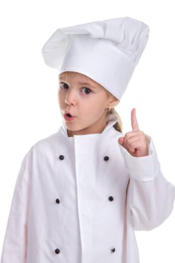 Özenli kız Şef beyaz üniforma ile işaret eden bir parmağa doğruca kameraya bakmak beyaz zemin üzerine izole. Dikkat işareti. Portre resim