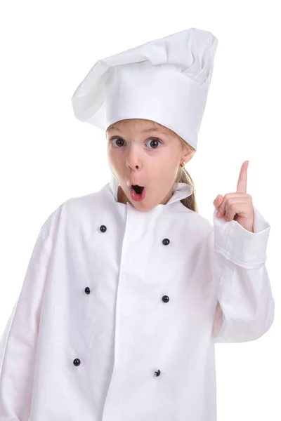 有了这个想法。惊讶的女孩厨师白色制服隔离在白色的背景, 直视着相机与指尖向上。人像图像 免版税图库图片