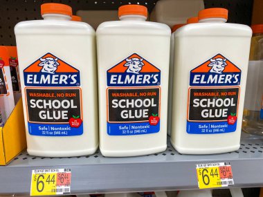 Orlando, FL/USA-7/19/20: A display of Elmers Glue in the school supply aisle at a Walmart in Orlando, Florida. clipart