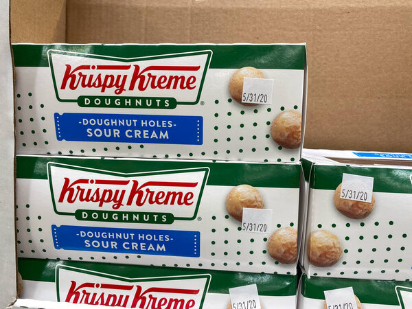 Orlando,FL/USA -5/15/20:  A stack of boxes of Krispy Kreme Doughnut Holes at a Sams Club grocery store ready to be purchased by consumers.