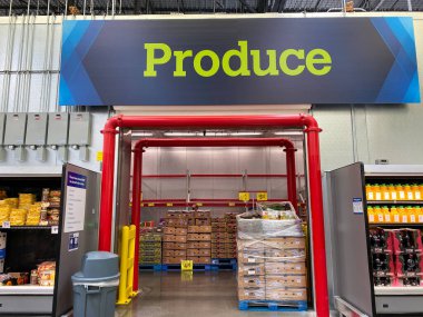 Orlando, FL/USA-8/6/20: The Produce sign above the refrigerated Produce room  at a Sam's Club warehouse store in Orlando, Florida. clipart