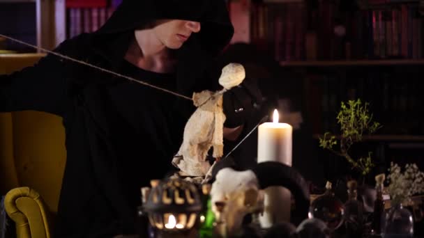 Session of black magic with voodoo doll — Stock Video
